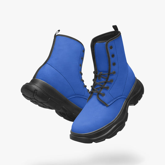 Pair of blue boots with black soles on a white background