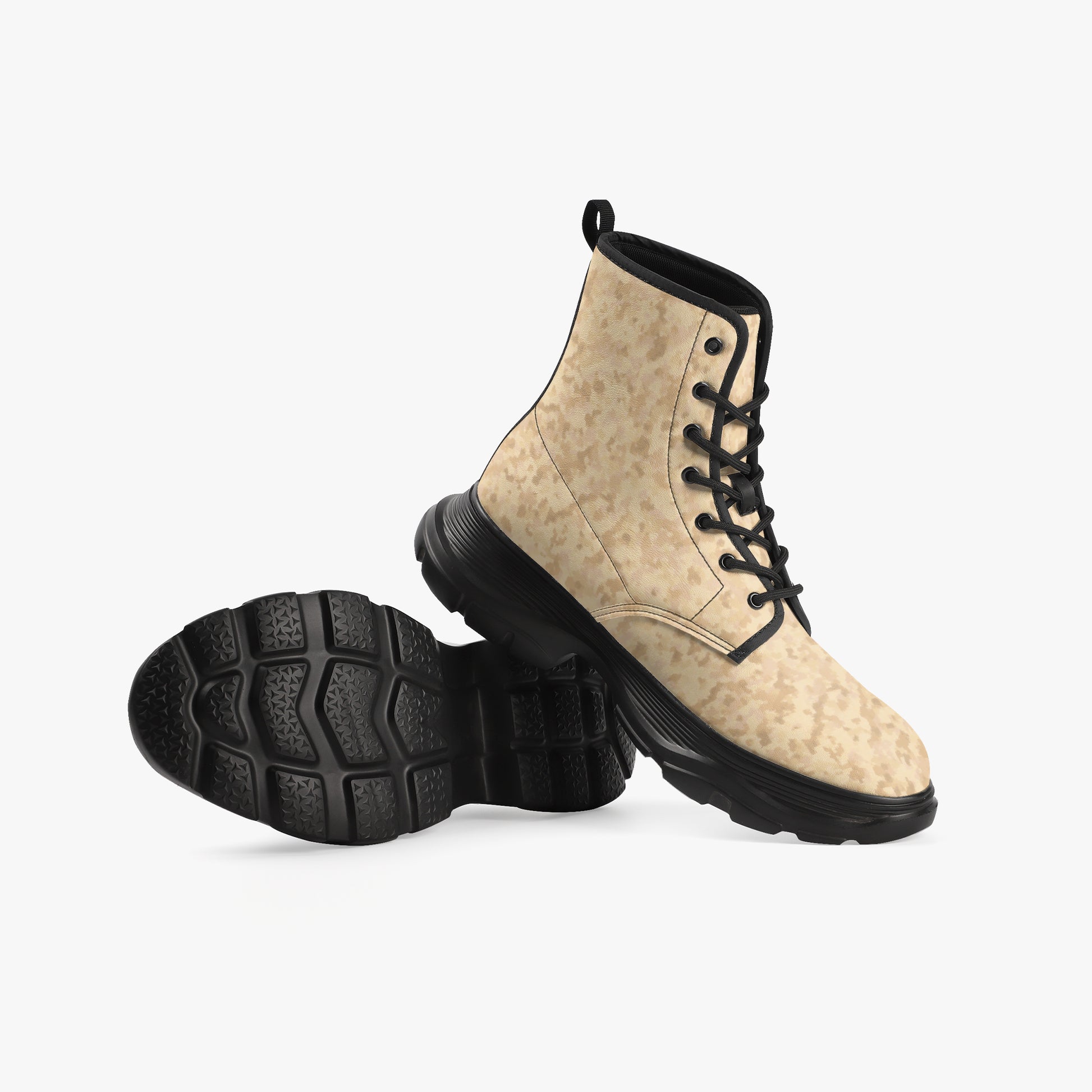 Camoflauge boots with black laces and sole on a light gray background, Camo boots