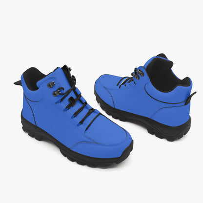 Pair of blue boots with black soles on a white background