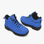 Pair of blue boots with black soles on a white background