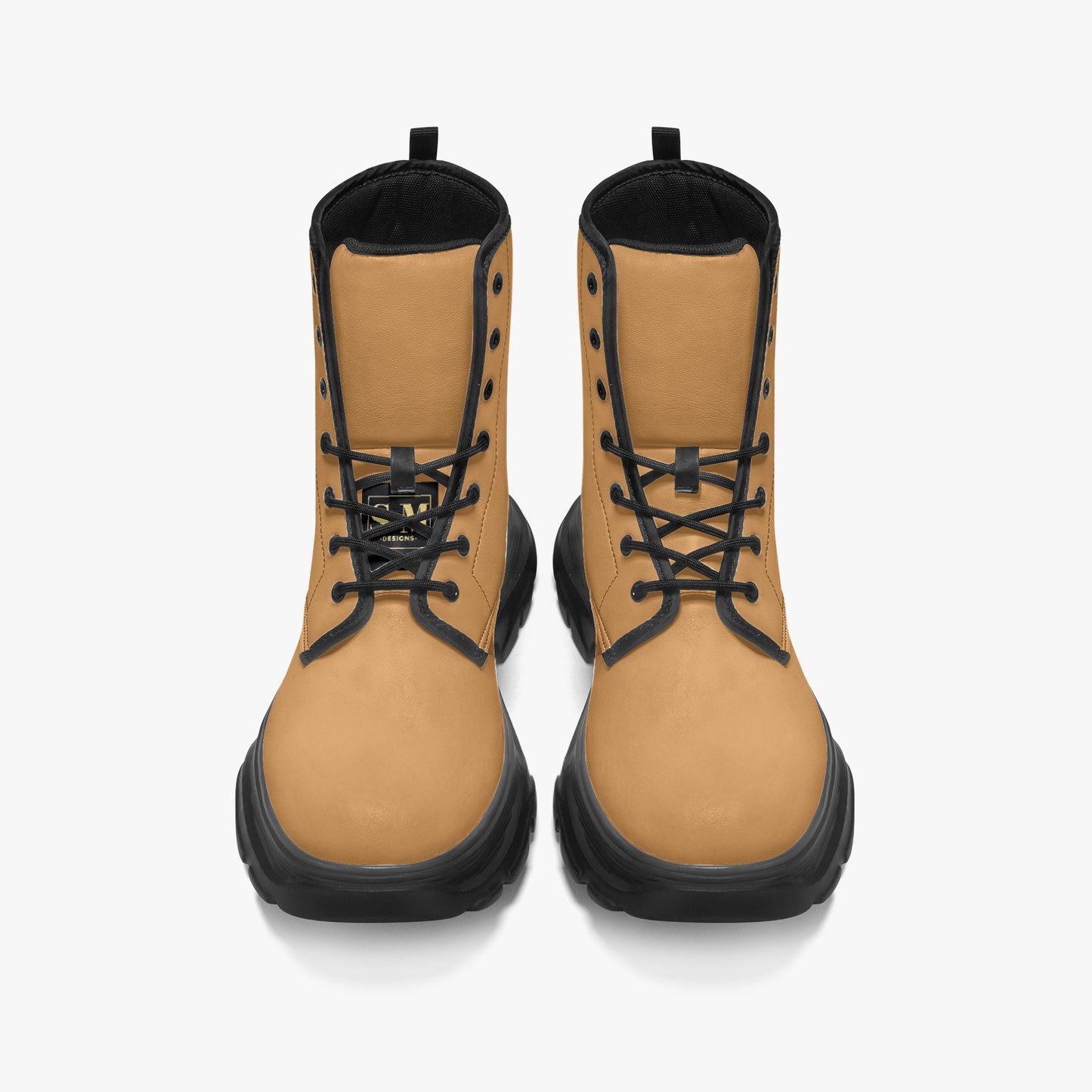 Pair of tan boots with black laces on a white background