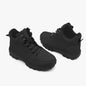 Pair of black boots on a white background