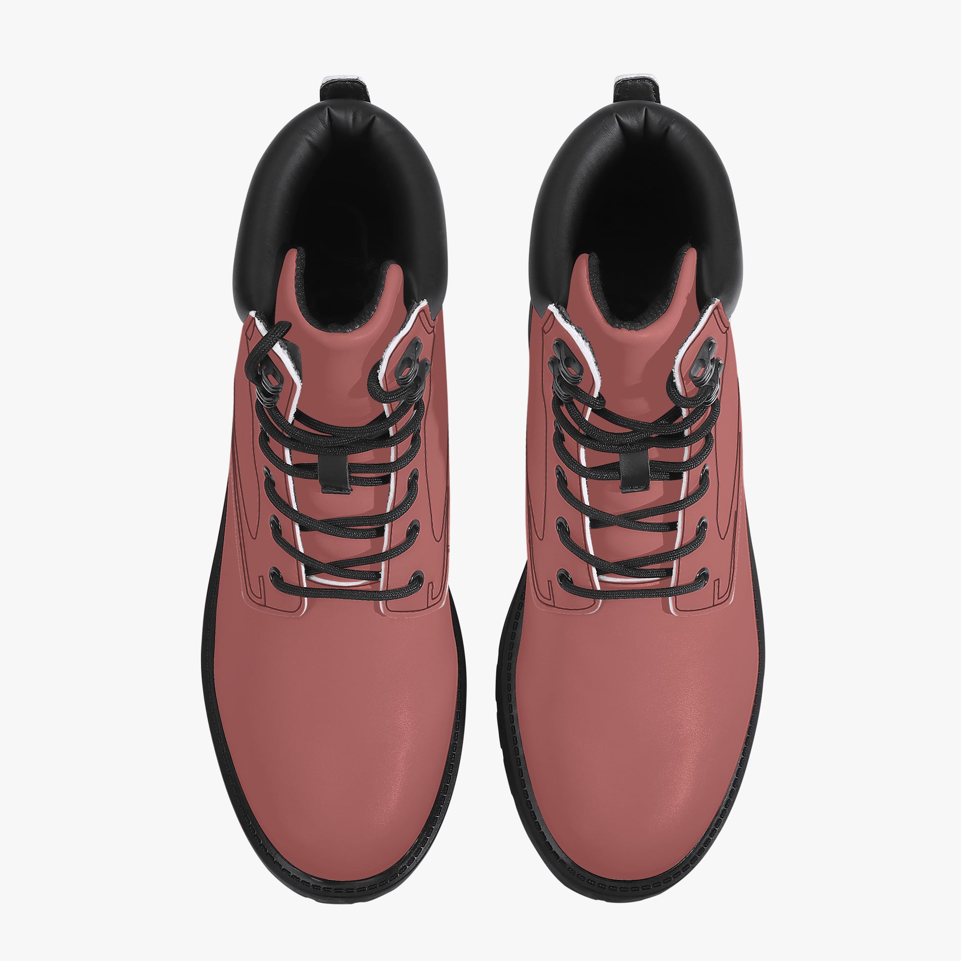 Pair of pink boots with black soles and laces on a white background