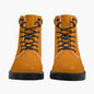 Pair of orange boots with black laces on a white background