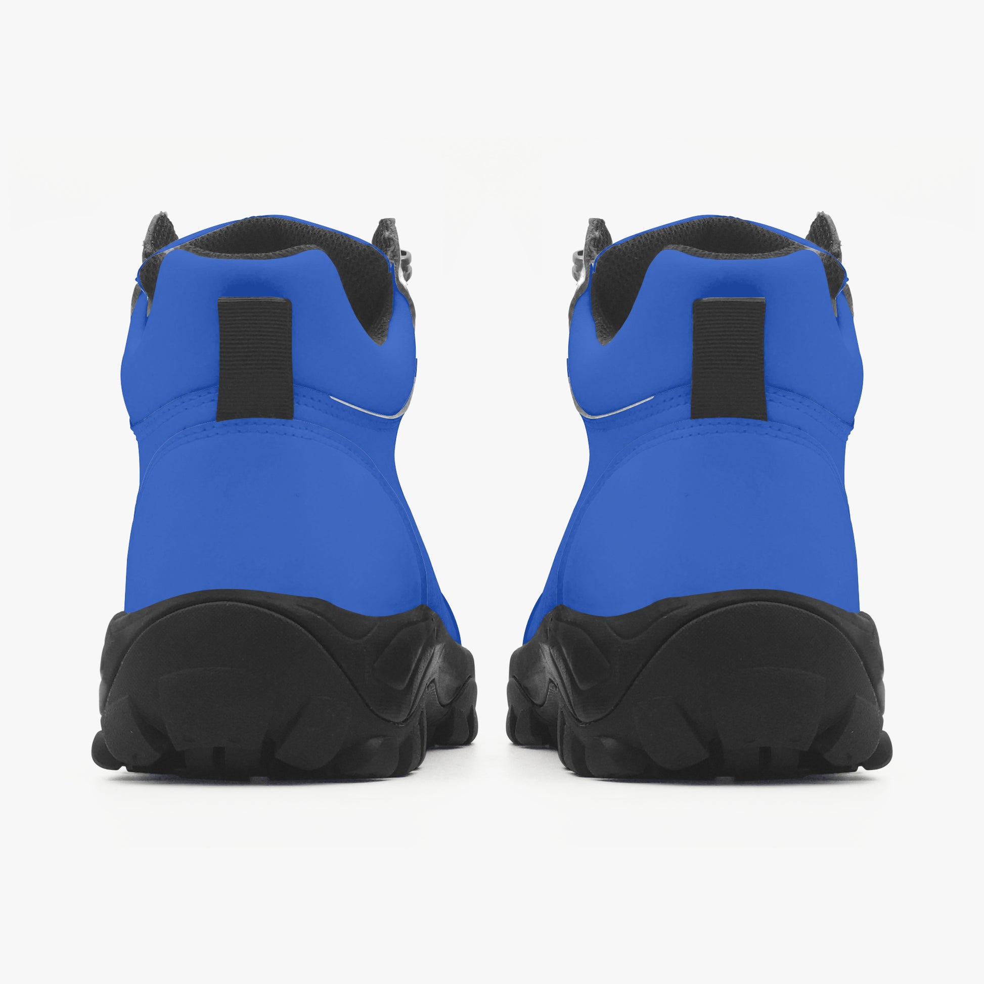 Blue and black hiking boots on a white background, 