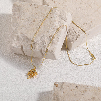 Gold octopus necklace on a chain against a white background- Front View- On Marble Slab