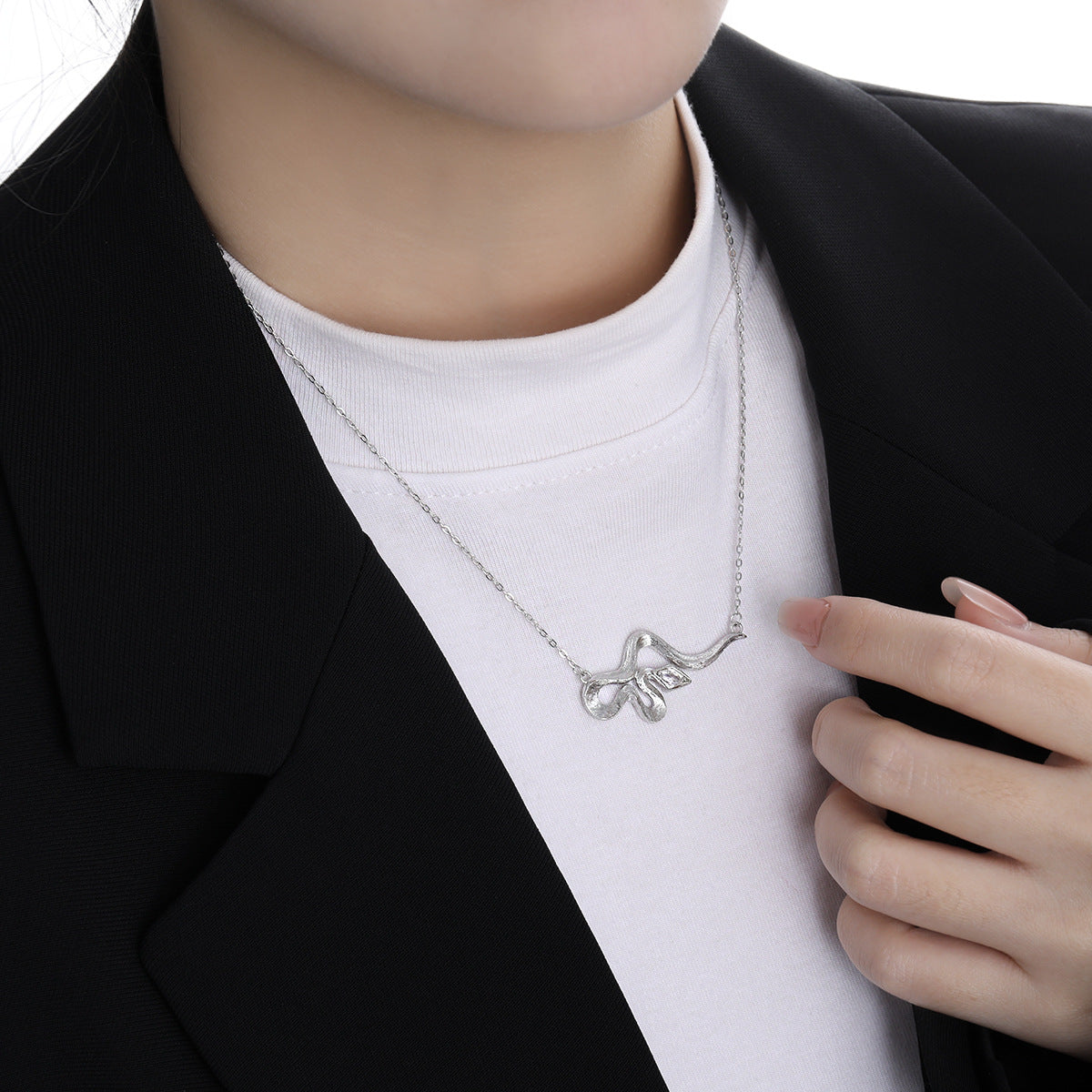 Modern Rhombus CZ curved snake necklace in 925 sterling silver with cubic zirconia pendant, Displayed on Neck