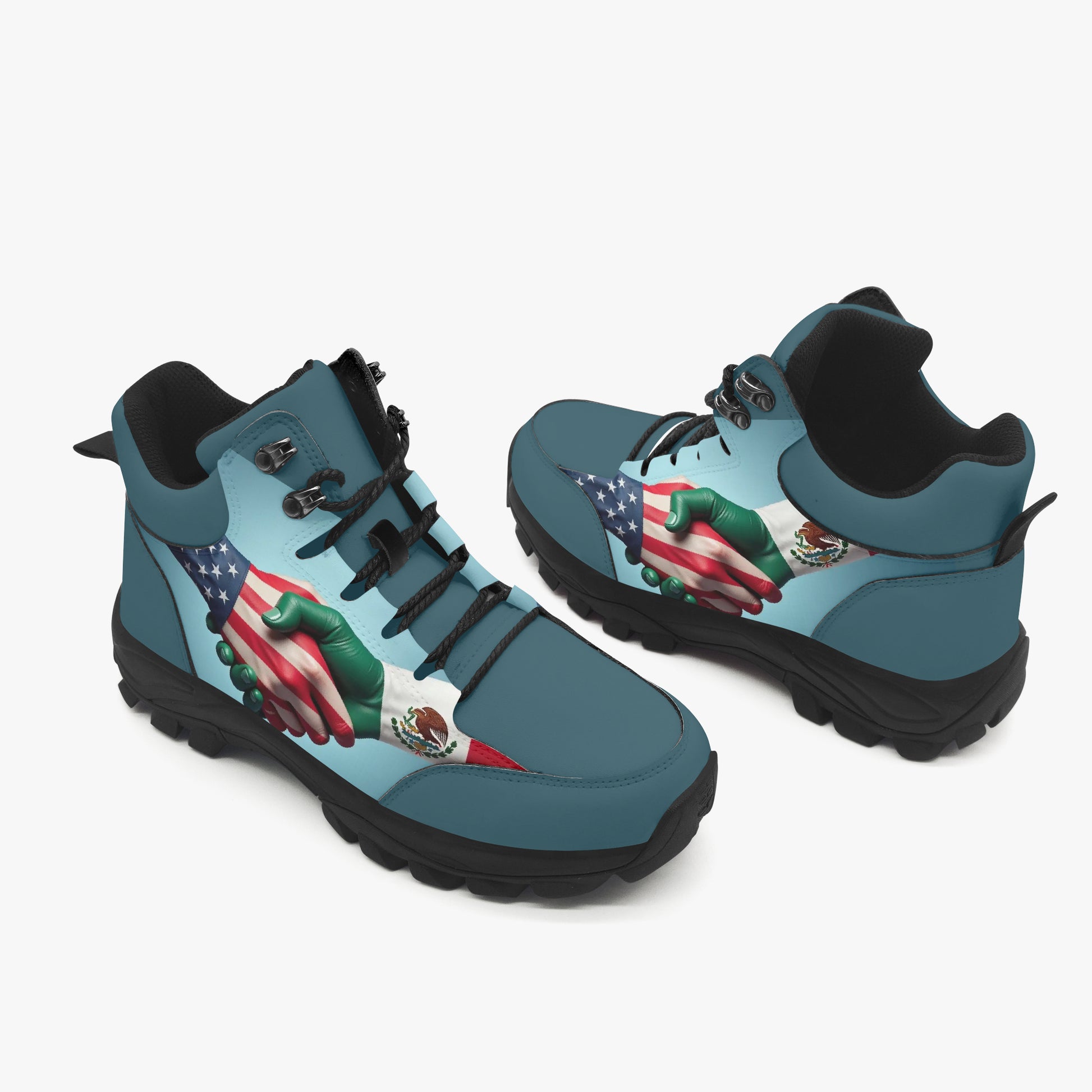 Pair of blue hiking boots with a handshake design featuring American and Mexican flags on a white background.