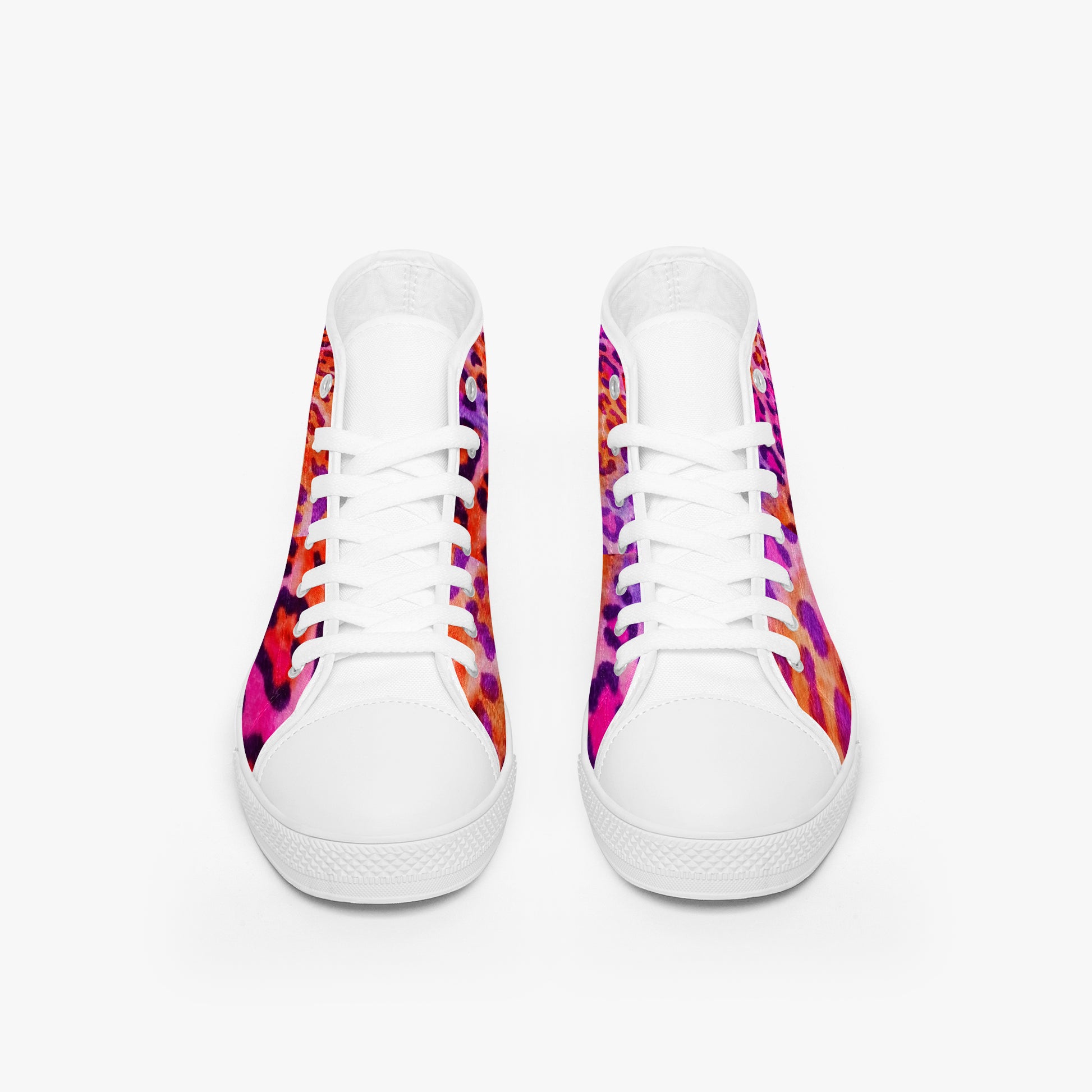White sneakers with colorful patterned soles on a white background