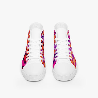 White sneakers with colorful patterned soles on a white background