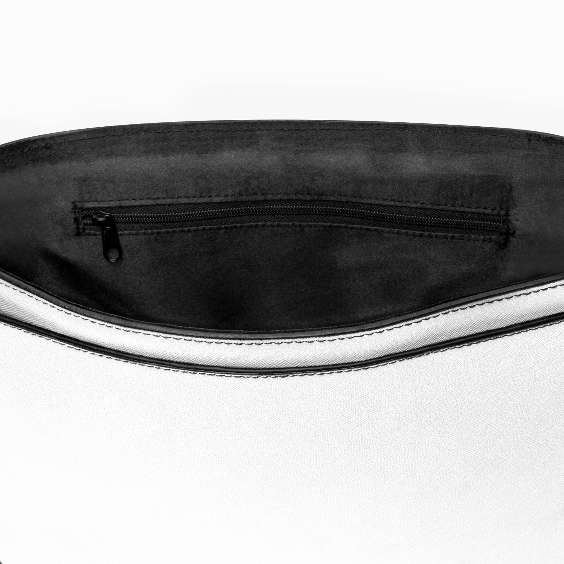 Close-up of a black and white bag with a zipper