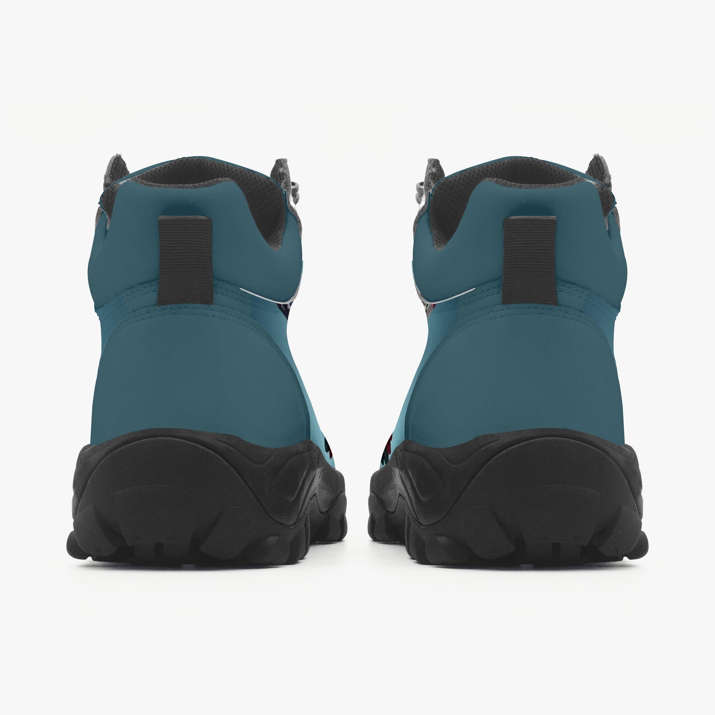 Pair of teal and black boots on a white background