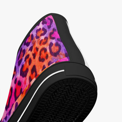 Close-up of a slip-on shoe with a colorful leopard print on a white background