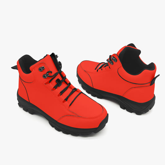 Pair of red boots with black soles on a white background