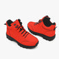 Pair of red boots with black soles on a white background