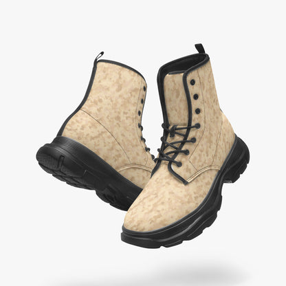 Pair of camoflauge boots with black soles on a white background, Camo boots