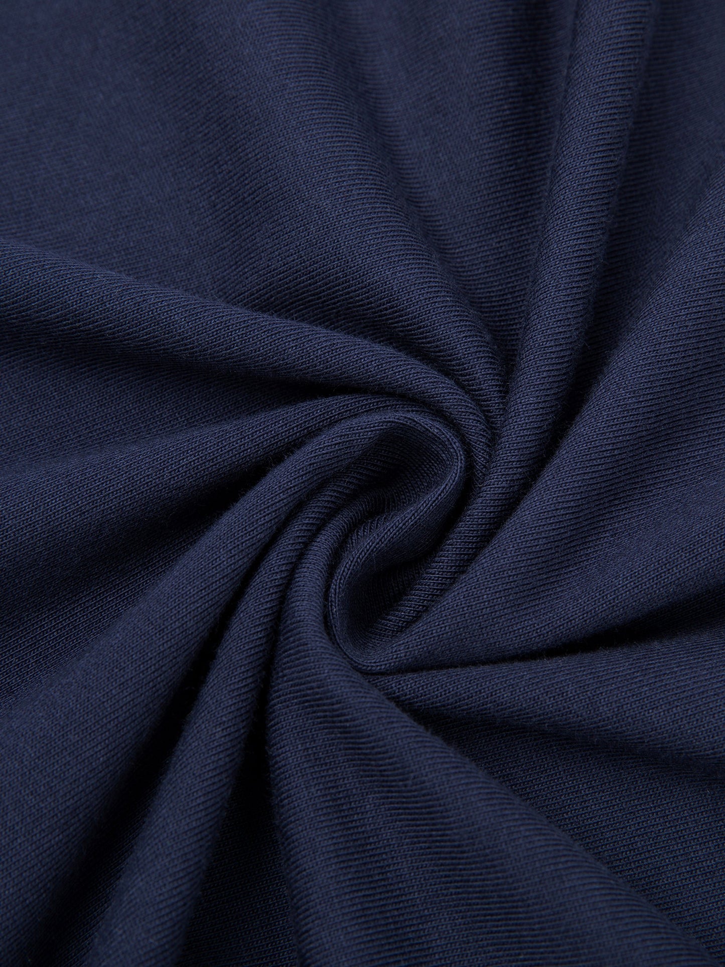 Close-up of dark blue T- Shirt fabric with folds