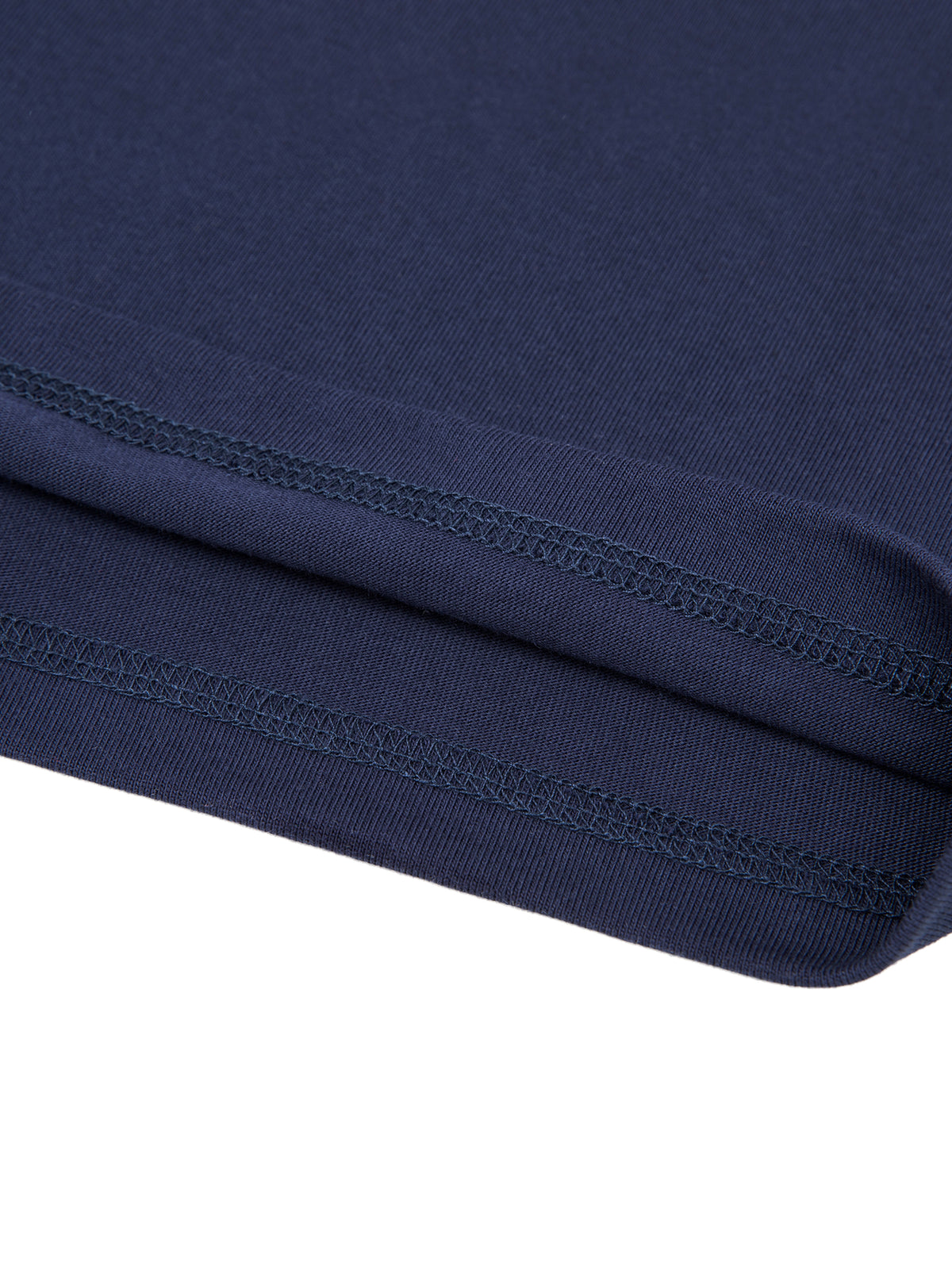 Close-up of a navy blue T-Shirt fabric with stitching detail on a white background